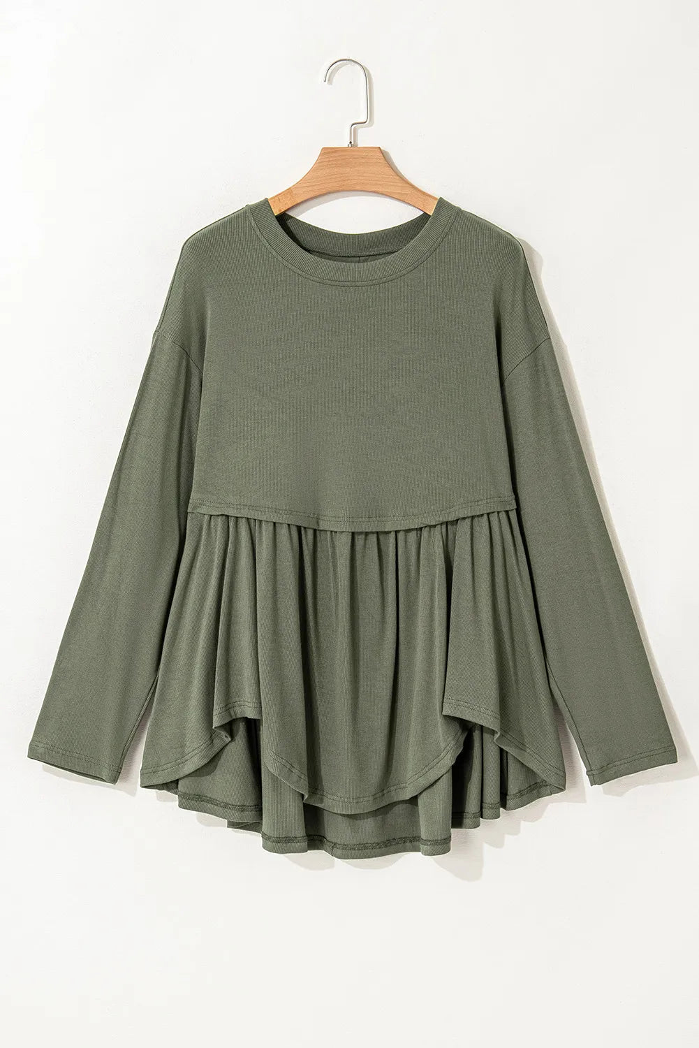 Moss ribbed peplum blouse with long sleeves and tiered ruffled hem