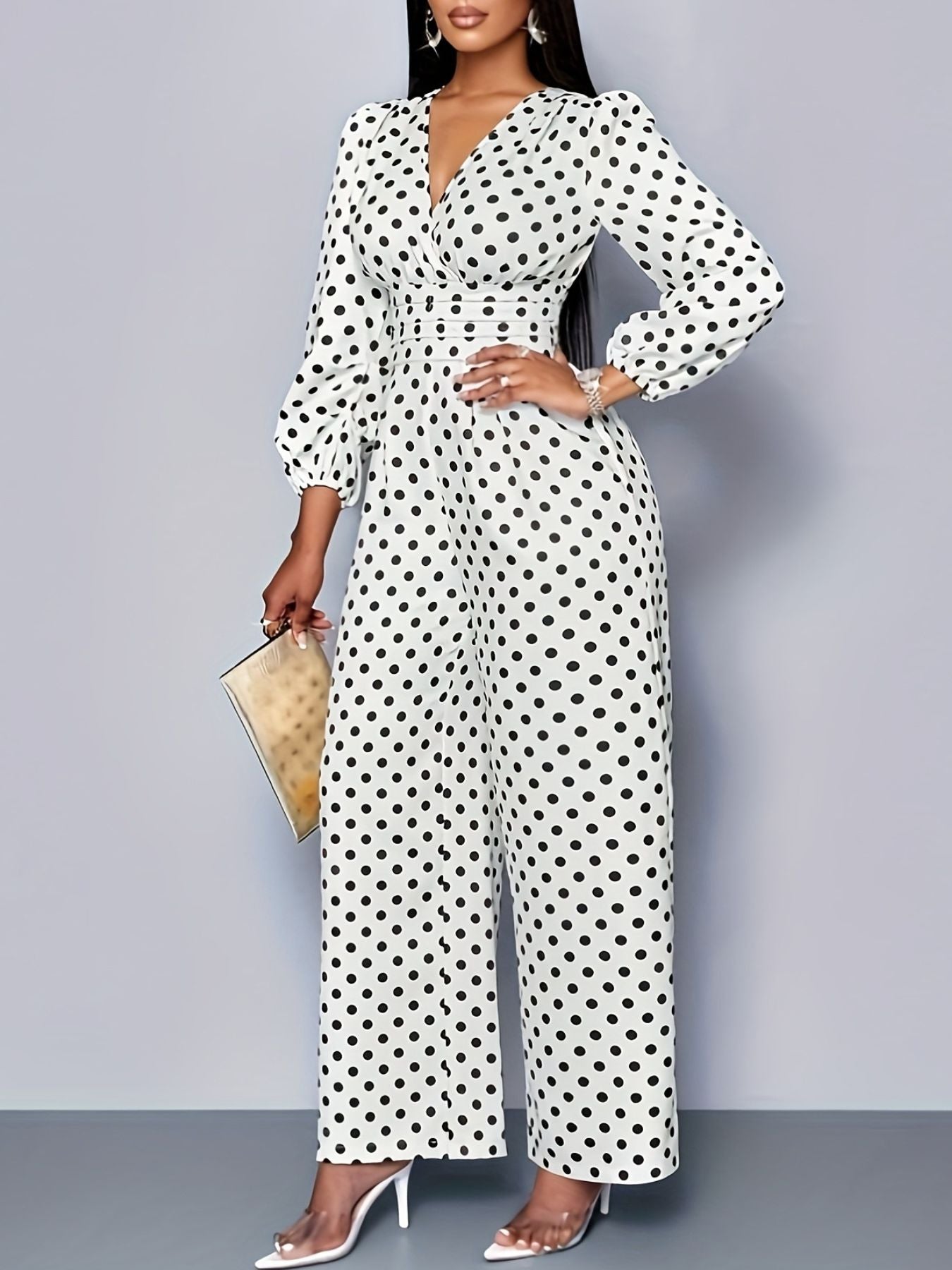 Chic white polka dot wide-leg jumpsuit with balloon sleeves and a V-neck.