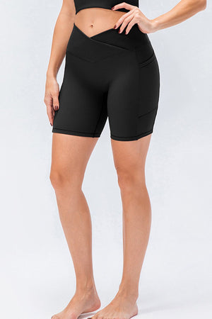 Black ribbed cross-waist bike shorts with side pockets