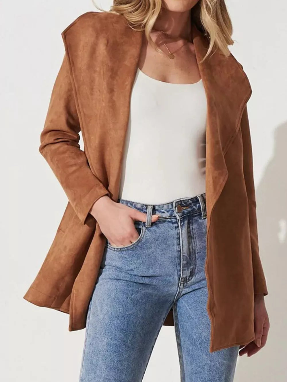 Bronze suede duster jacket with waterfall collar and tie waist, worn open over a white tank and jeans.