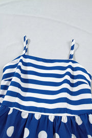 Blue and white striped maternity swim dress with polka dot skirt and spaghetti straps.