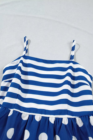 Blue and white striped maternity swim dress with polka dot skirt and spaghetti straps.