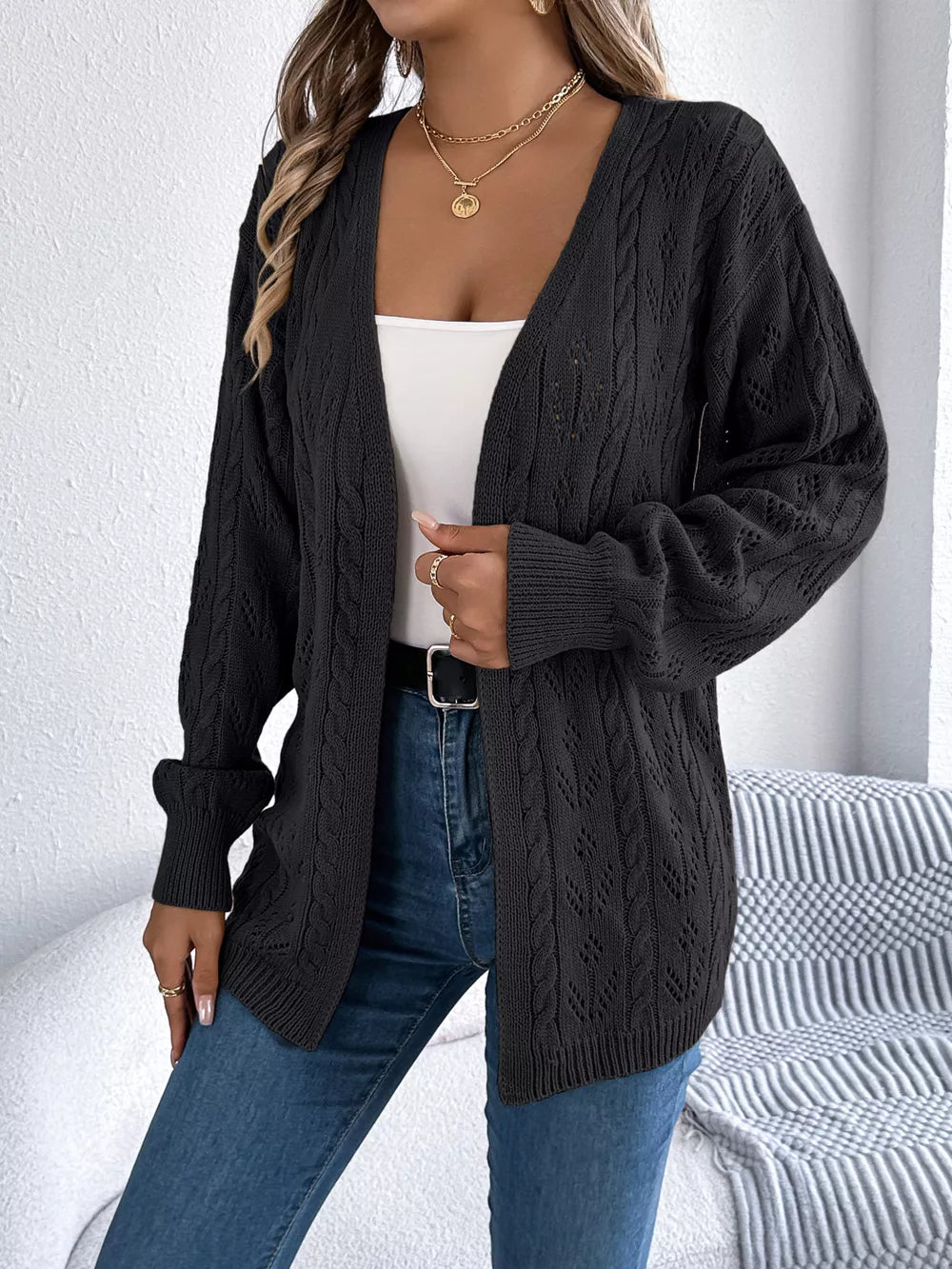 Black openwork cable knit long sleeve cardigan with open front