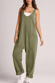 Relaxed fit jumpsuit in sage green with oversized pockets and cuffed ankles.