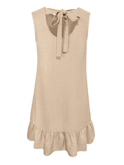 Backless mini dress in beige with ruffled hem and tie neck