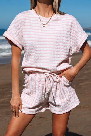 Textured stripe lounge set in blush pink with a relaxed fit t-shirt and drawstring shorts.