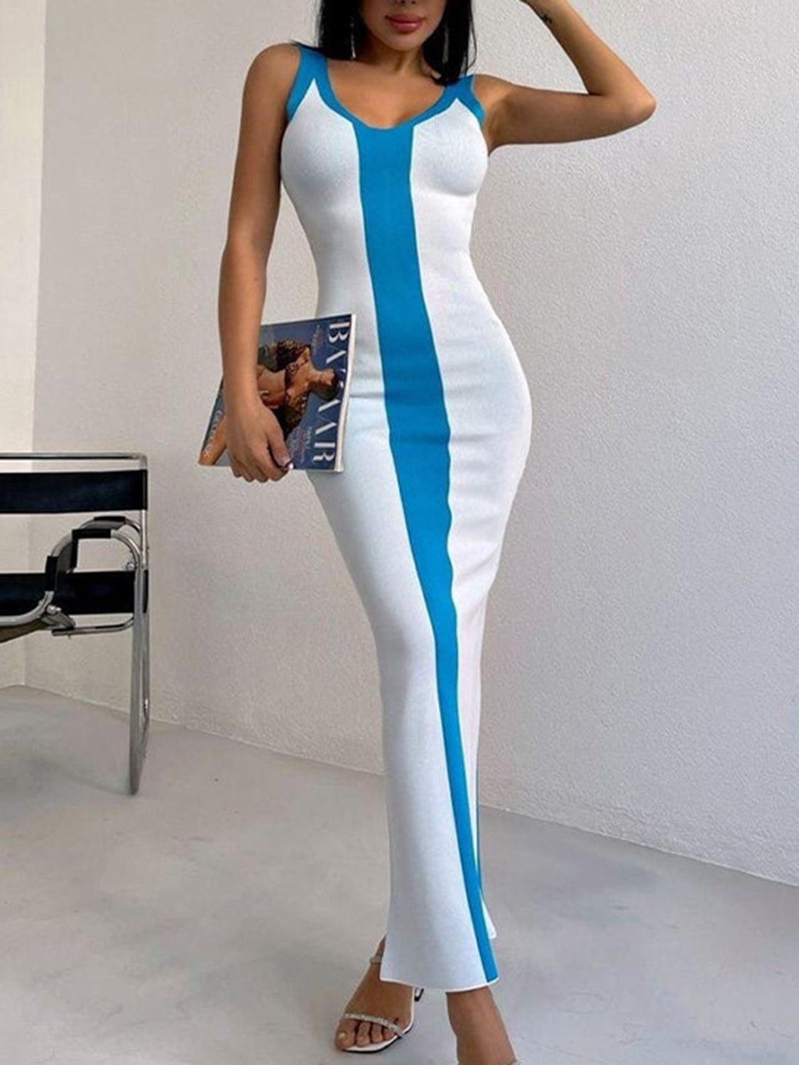 White bodycon maxi dress with bold blue contrast stripe detail and V-neck.