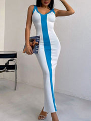 White bodycon maxi dress with bold blue contrast stripe detail and V-neck.