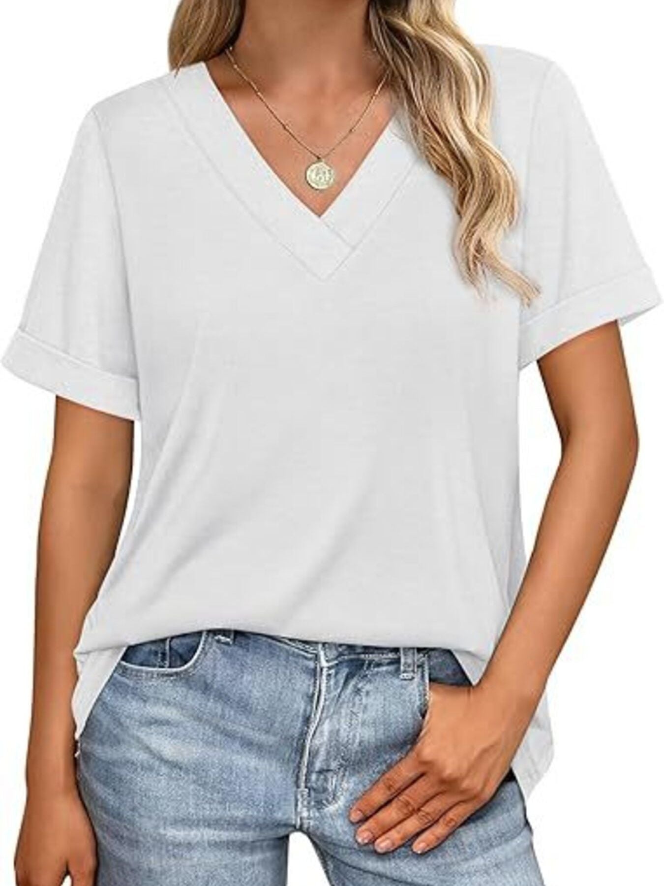 White v-neck t-shirt with cuffed short sleeves, styled with jeans.
