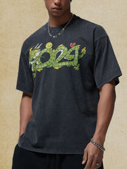 Black washed cotton tee with a bold green dragon graphic and a crew neck.