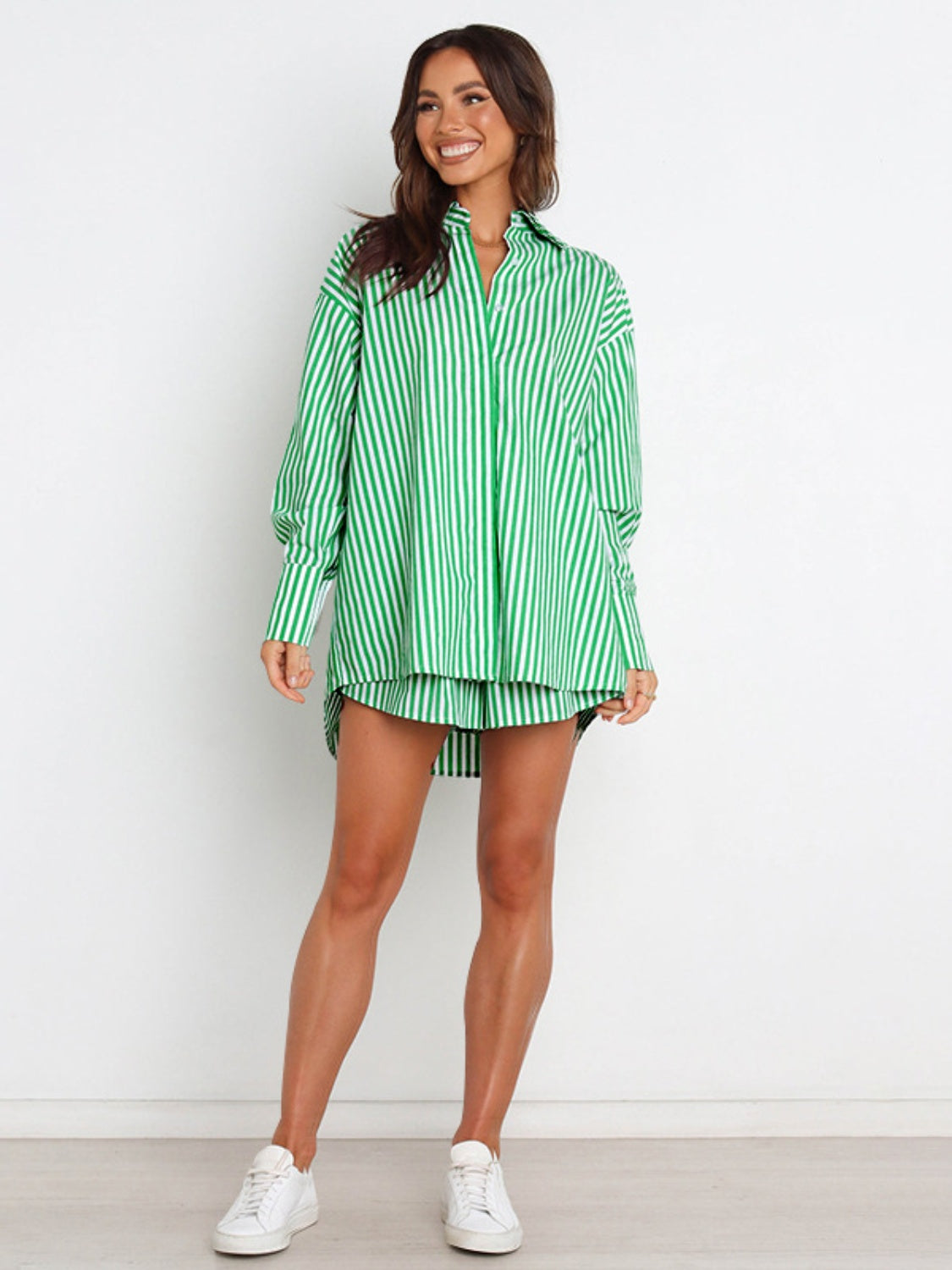 Green and white striped oversized shirting short set with a collared neckline and button-up front.