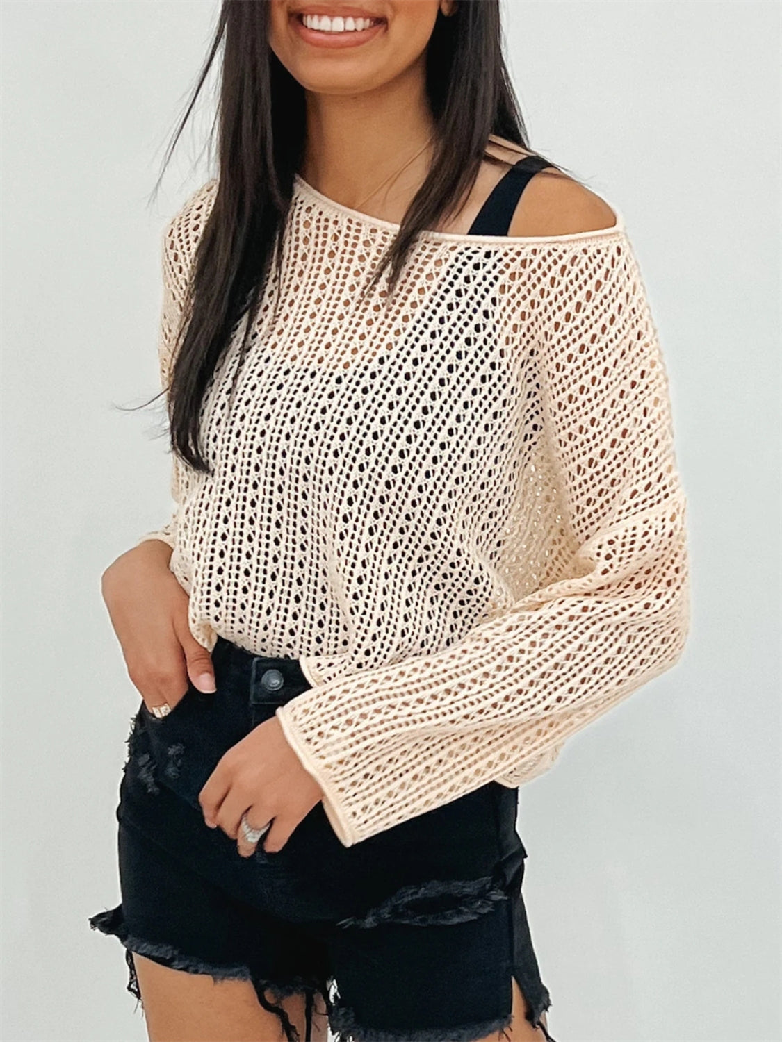 Open-knit slouchy shoulder sweater in tan with a relaxed fit and long sleeves.