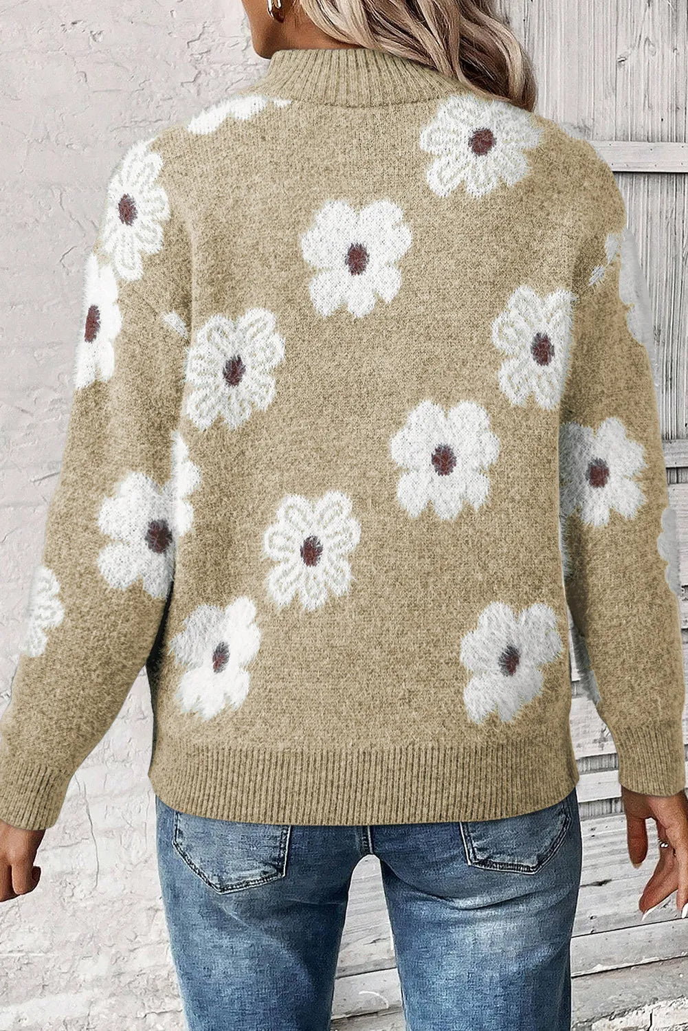 Tan acrylic mock neck sweater with allover white floral intarsia pattern.