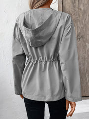 Gray hooded utility jacket with cinched waistline detail and drawstring.