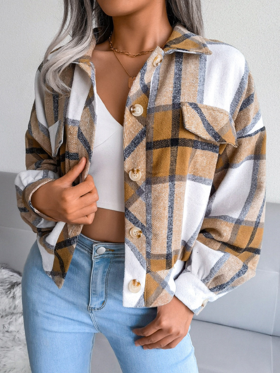 Oversized tartan shacket in camel and white with patch pockets and button front.