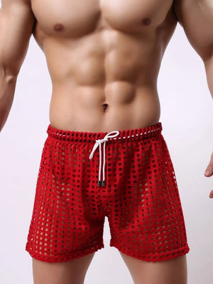 Red perforated sport shorts with drawstring waist and mesh detail.