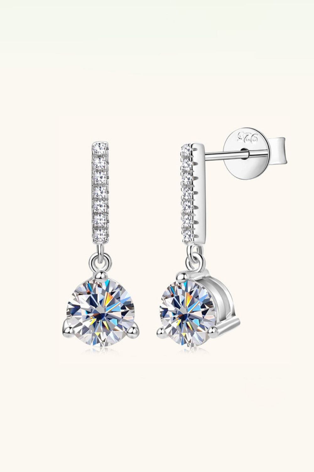 Silver drop earrings with clear cubic zirconia studs and a round solitaire gem.
