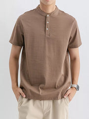 Brown cotton henley t-shirt with short sleeves and button placket.