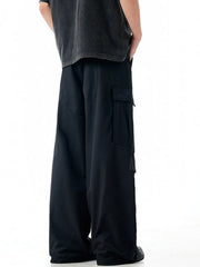 Black cargo sweatpants with large side pockets and a relaxed fit.