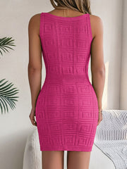 Hot pink knit bodycon mini dress with geometric pattern and ribbed waist detail.