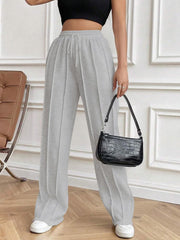 Light gray pleated palazzo drawstring trousers with a wide leg and a casual fit.