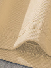 Beige cotton baby girls' underwear set detail showing seams and fabric texture.