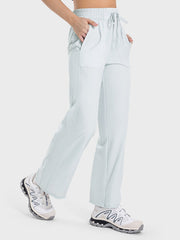 Relaxed fit palazzo pants in Cloudy Blue with drawstring waist and pockets.
