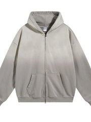 Oversized zip-up hoodie in gray with vintage wash and front pocket.