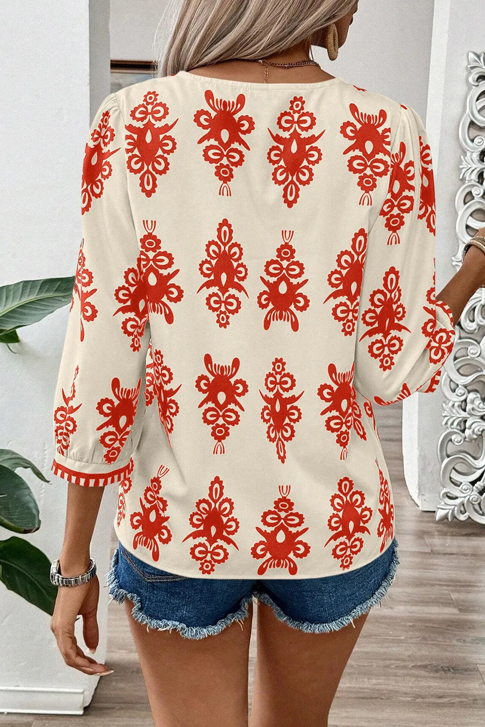 Ivory V-neck blouse with red embroidery and contrast trim sleeves