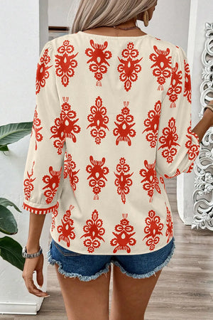 Ivory V-neck blouse with red embroidery and contrast trim sleeves