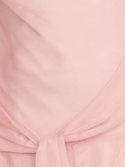 Pink maxi dress with draped knot detail and subtle vertical texture.