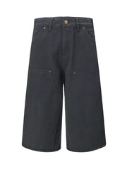Dark gray relaxed fit utility capris for men with multiple pockets and brass button closure.
