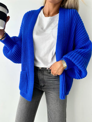 Royal blue textured puff sleeve cardigan with pockets and ribbed details.