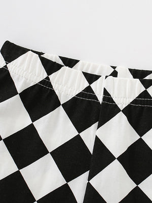 Black and white checkerboard baby shorts with elastic waistband
