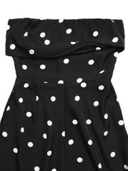Black polka dot strapless wide-leg jumpsuit with ruched bodice detail.