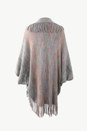 Textured stripe fringe cape in multicolor acrylic with fringe detail.