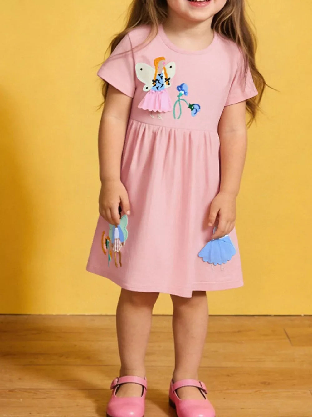 Toddler cotton dress with charming appliqué, embroidered detail.