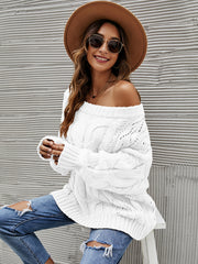 White cable knit off-shoulder slouch sweater with open knit details and long sleeves.