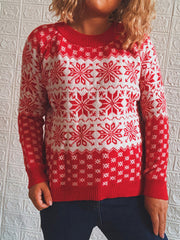 Red and white snowflake knit pullover sweater with crew neck.