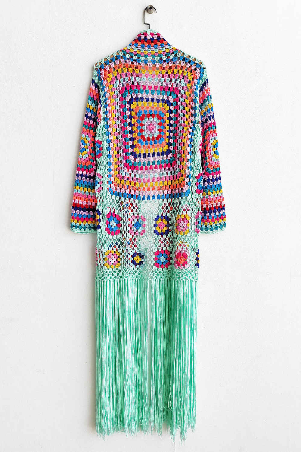 Granny square crochet duster with fringe in multicolor and mint green, open front, long sleeves, boho style.