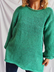 Turquoise open-knit acrylic boatneck sweater with slouchy fit and ribbed cuffs.