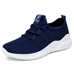 Navy breathable knit runner sneaker with white sole and logo detail on tongue.