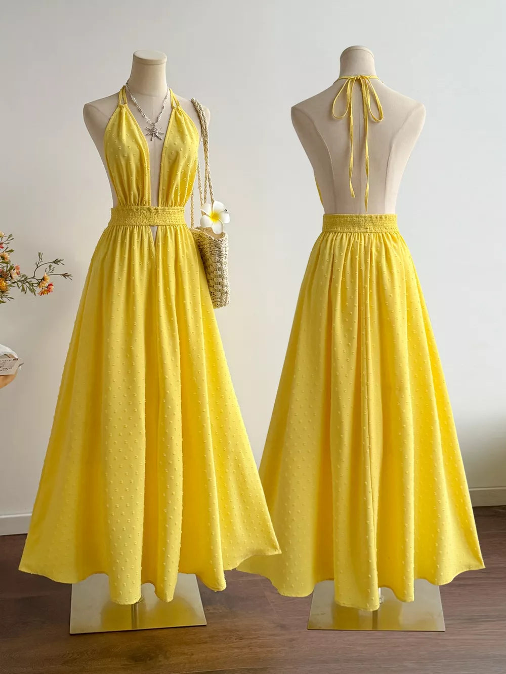 Yellow Swiss dot halter maxi dress with a-line skirt and smocked waist.