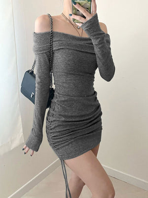 Grey ruched bodycon mini dress with off-the-shoulder neckline and drawstring detail.