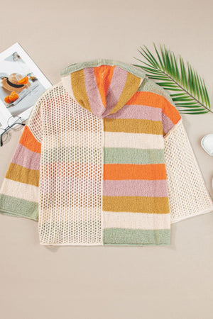 Colorblock knit hoodie with open crochet and striped sections in orange, pink, yellow, and green.