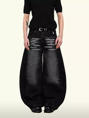 Belted wide leg denim jeans in black with a balloon silhouette and 100% cotton fabric.