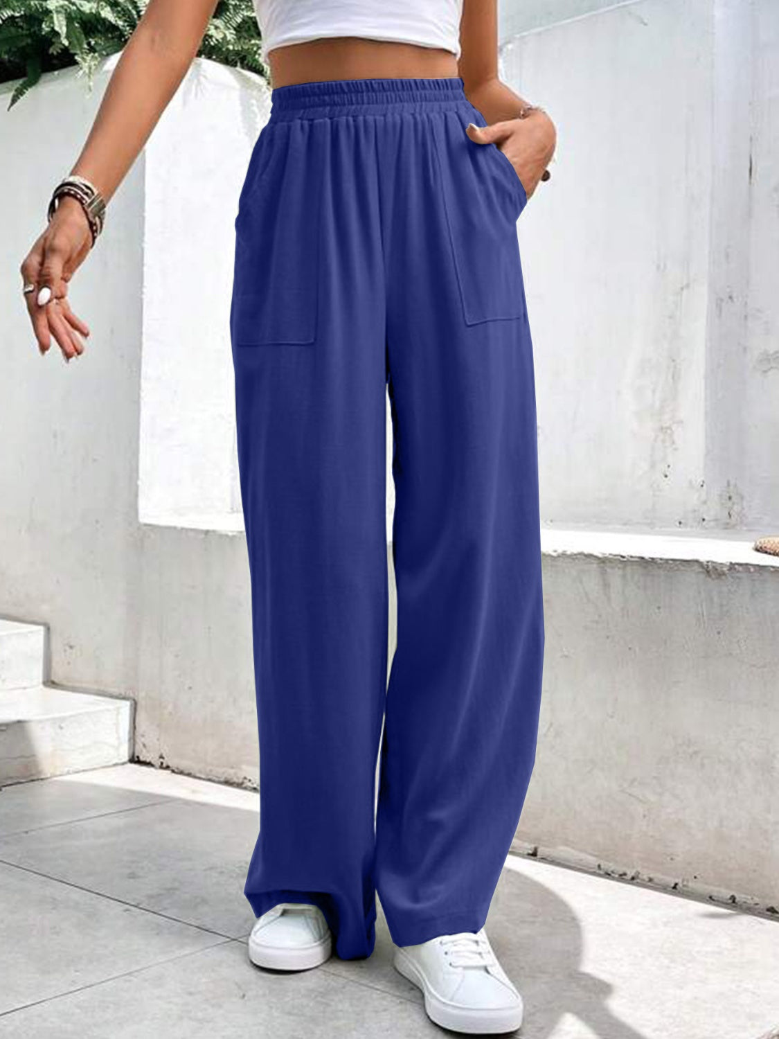 Royal blue relaxed drape palazzo trousers with pockets and elastic waist.