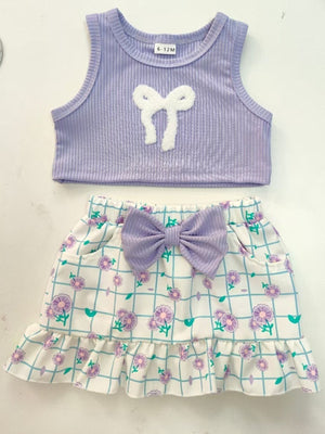 Lavender ribbed tank top with white bowknot and floral print skirt with purple bowknot