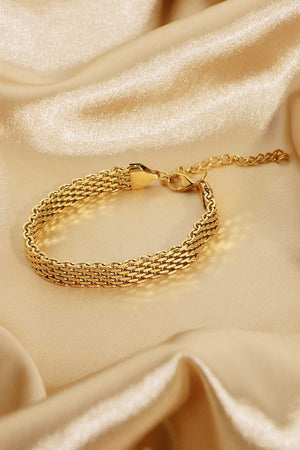 Gold woven chain bracelet with adjustable clasp and extender chain.