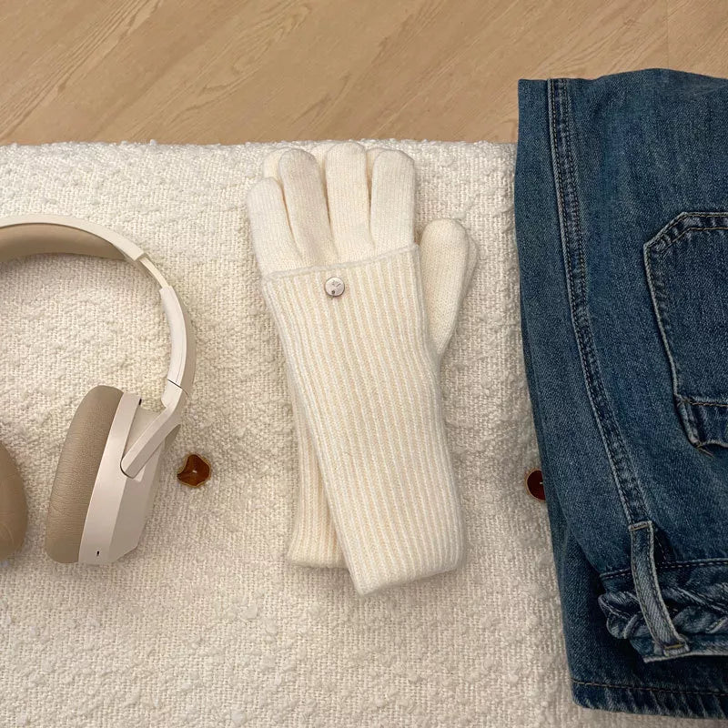 Off-white ribbed knit convertible gloves with button detail and touchscreen fingertips.